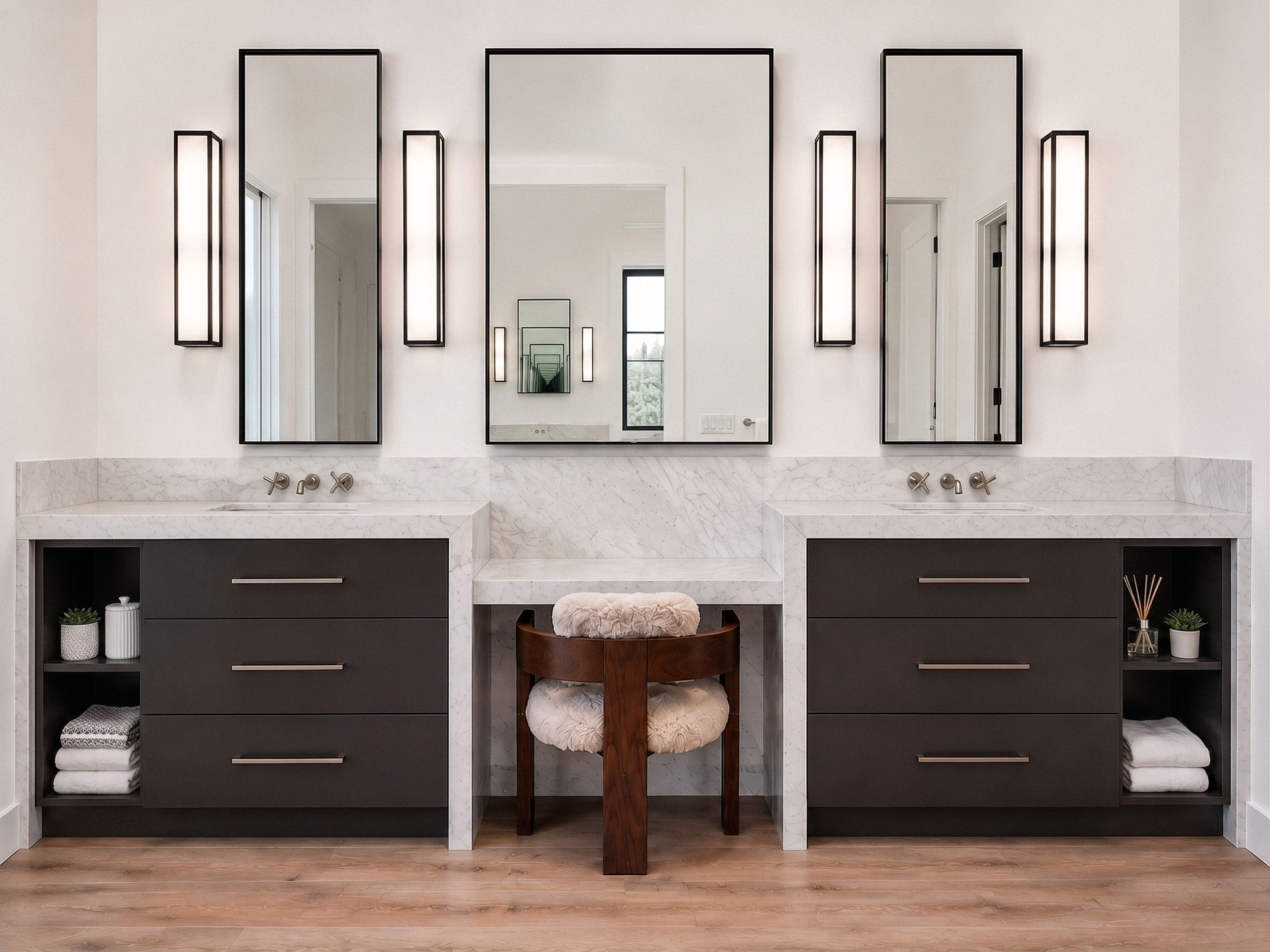 Luxury bathroom vanity with custom cabinetry and sculptural lighting