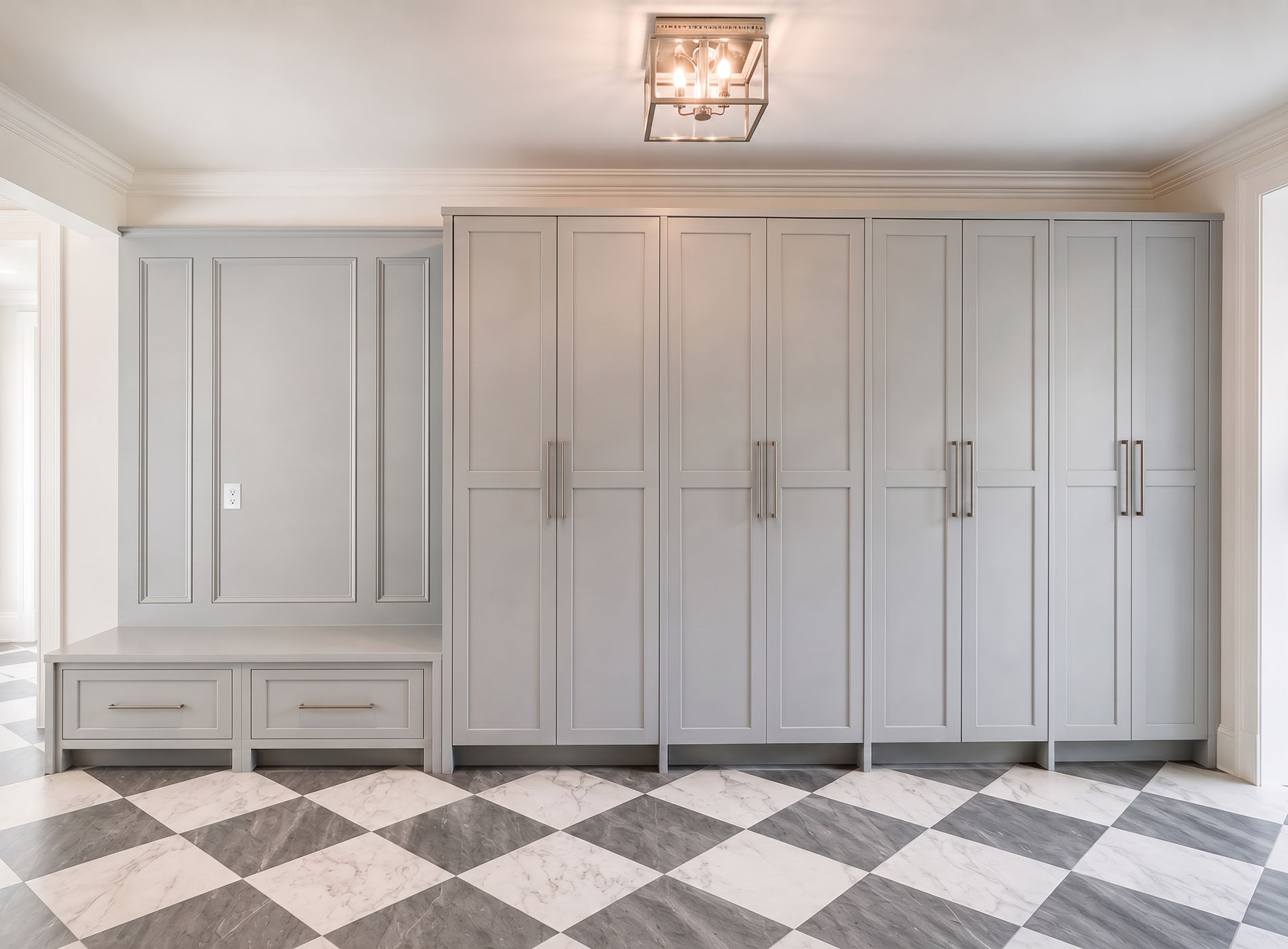 Custom storage cabinetry with seamless millwork and integrated storage
