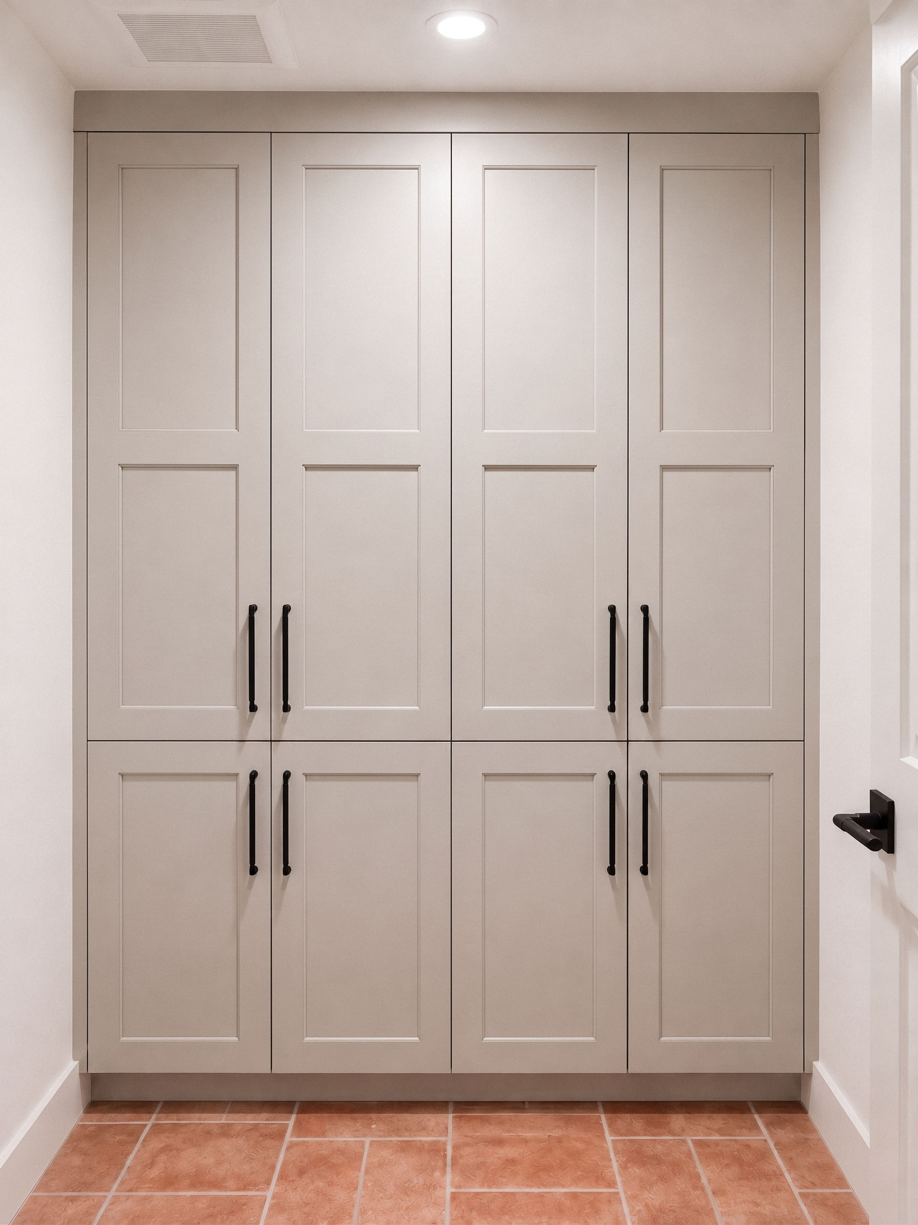 Custom laundry cabinetry with clean lines